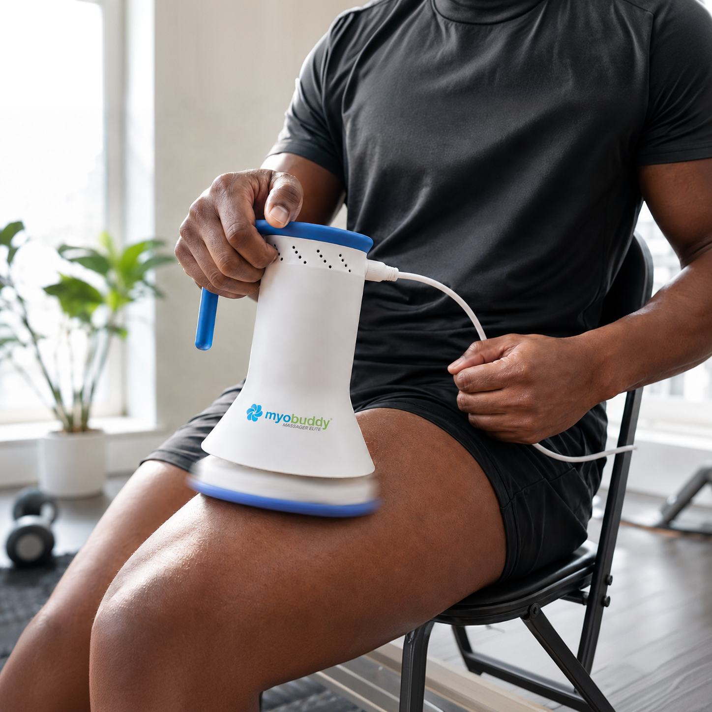MyoBuddy Pro Elite on the thigh, cord running to the outlet