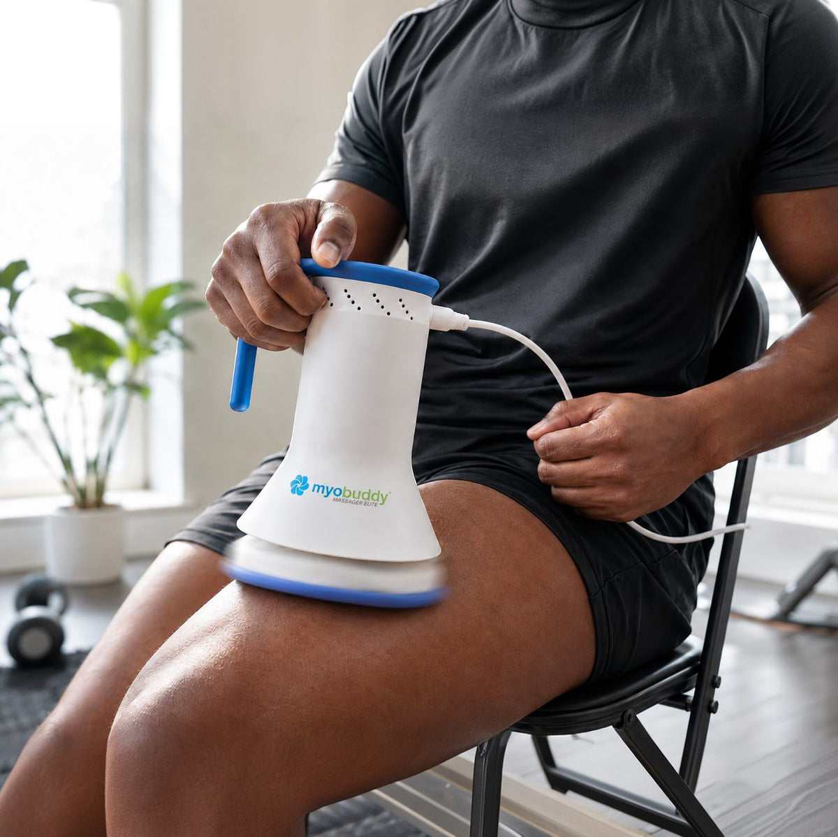 MyoBuddy Pro Elite on the thigh, cord running to the outlet